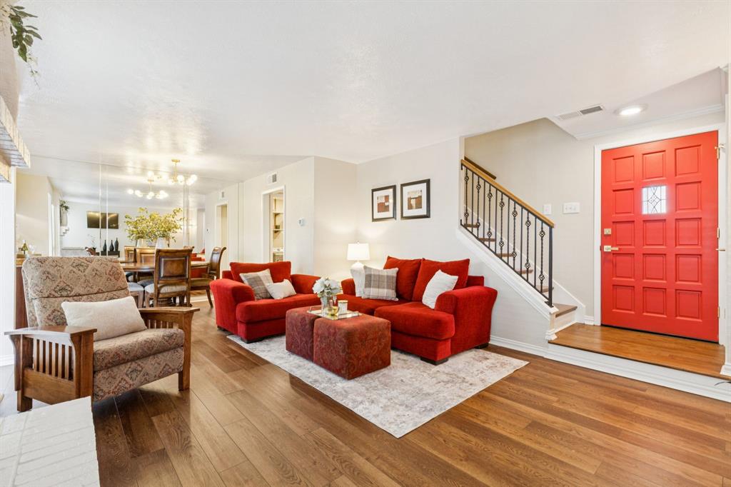2016 Via Miramonte Carrollton, TX 75006 - Photo 9 of 34 a living room with furniture kitchen view and a wooden floor
