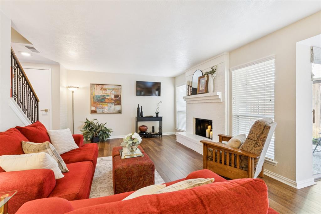 2016 Via Miramonte Carrollton, TX 75006 - Photo 10 of 34 a living room with furniture fireplace and wooden floor