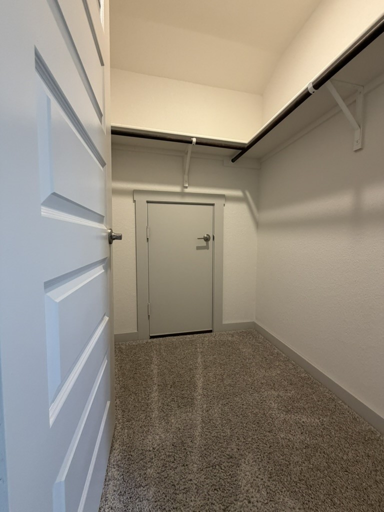 10708 Gonzales Ranger Pass Austin, TX 78754 - Photo 18 of 40 Ample hanging space and easy-care carpeting define this practical closet.