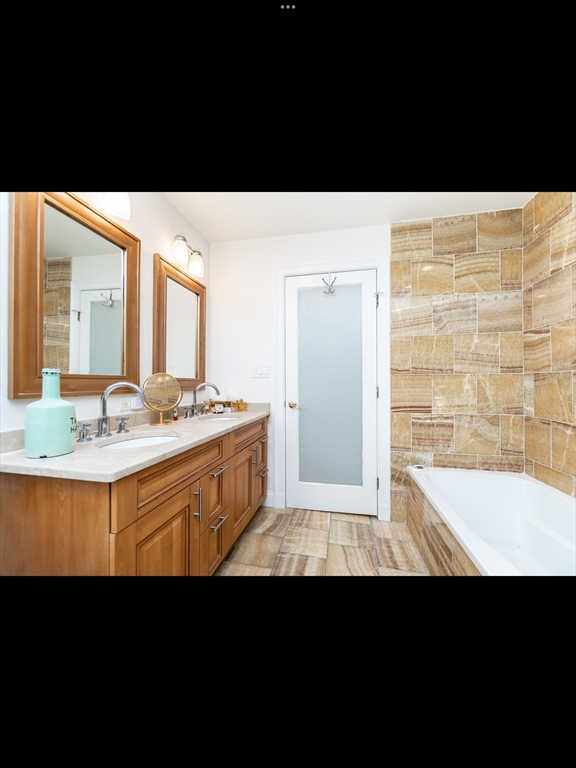 19 Worcester Square, Unit 1 Boston, MA 02118 - Photo 13 of 35 a bathroom with a sink and a mirror