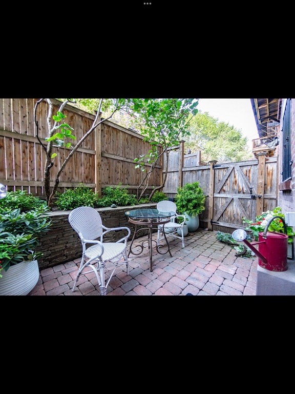 19 Worcester Square, Unit 1 Boston, MA 02118 - Photo 30 of 35 a view of a backyard with sitting area