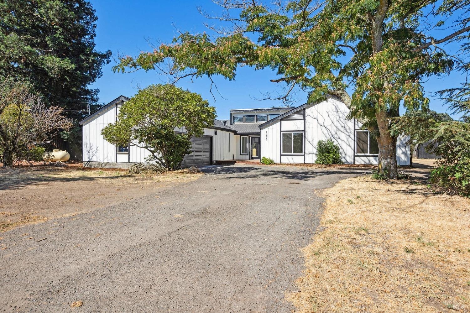 1282 Fowler Creek Road Sonoma, CA 95476 - Photo 1 of 86 a view of road with a building