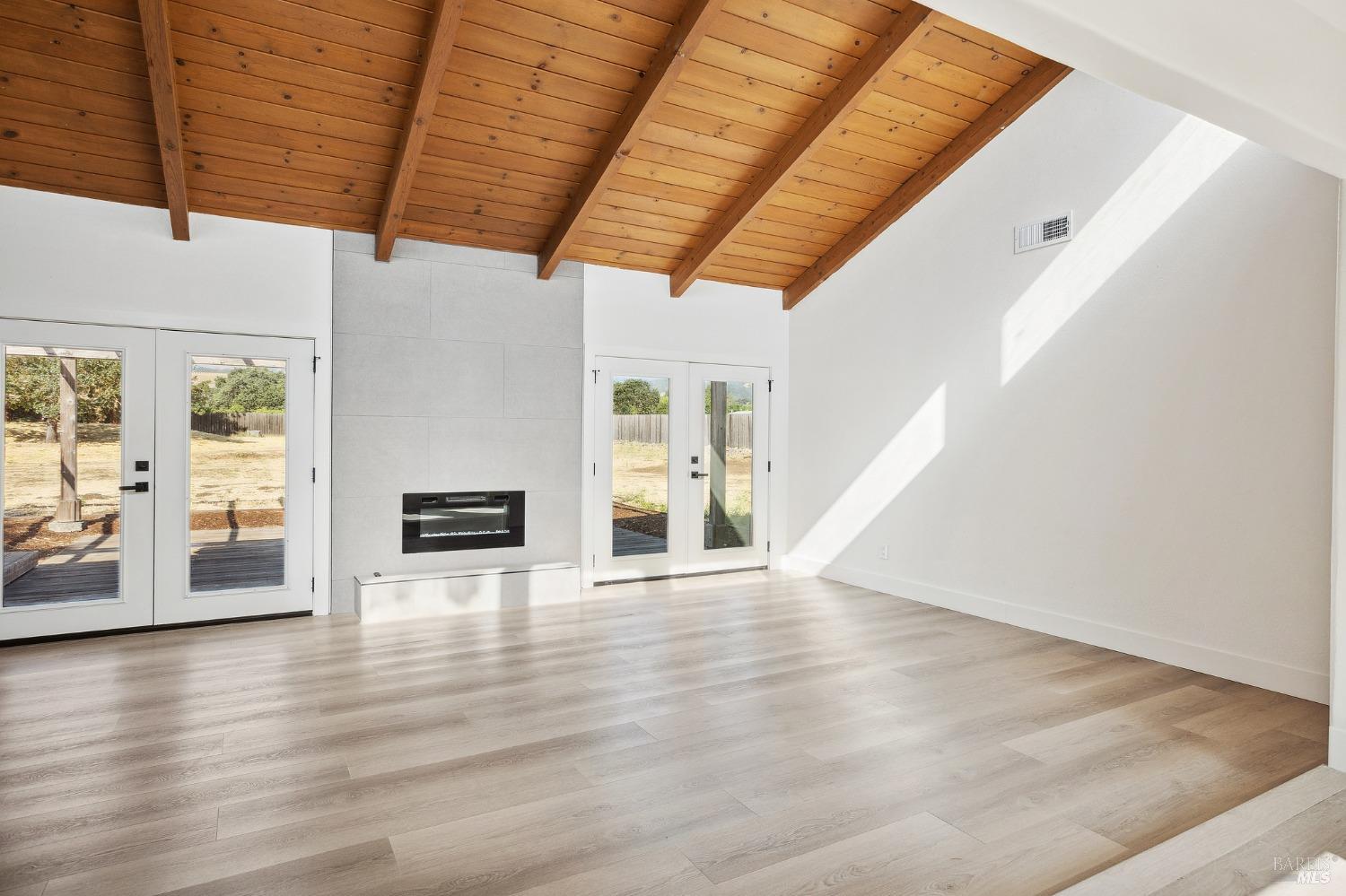 1282 Fowler Creek Road Sonoma, CA 95476 - Photo 13 of 86 a view of empty room with wooden floor