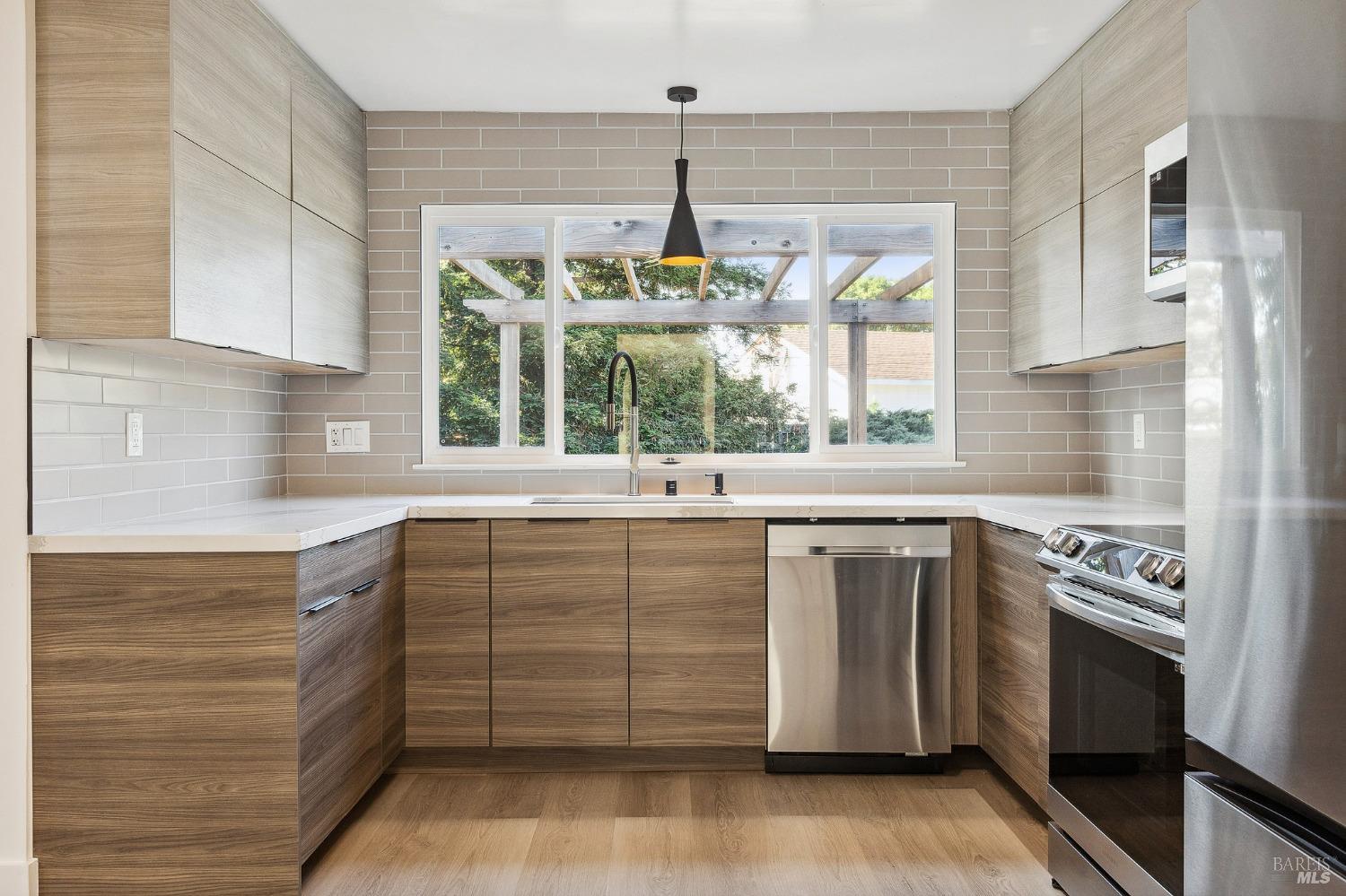 1282 Fowler Creek Road Sonoma, CA 95476 - Photo 15 of 86 a kitchen with stainless steel appliances granite countertop a stove and white cabinets