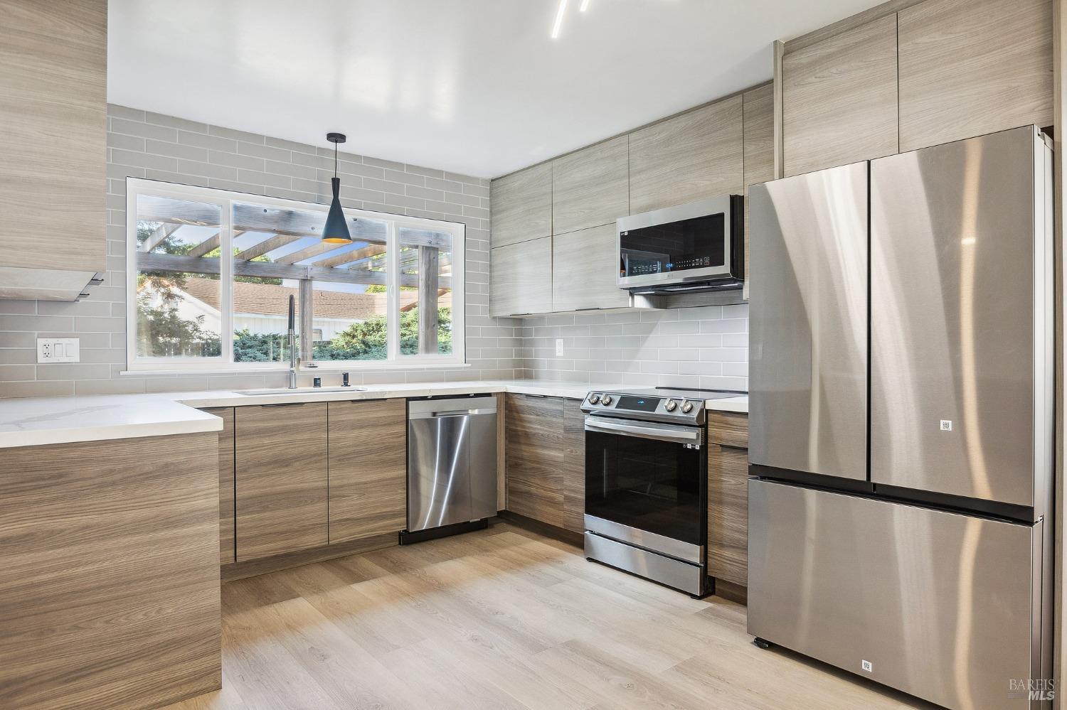 1282 Fowler Creek Road Sonoma, CA 95476 - Photo 16 of 86 a kitchen with stainless steel appliances a refrigerator sink and microwave