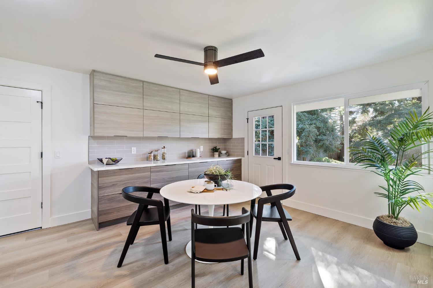1282 Fowler Creek Road Sonoma, CA 95476 - Photo 20 of 86 a view of a dining room with furniture and a potted plant
