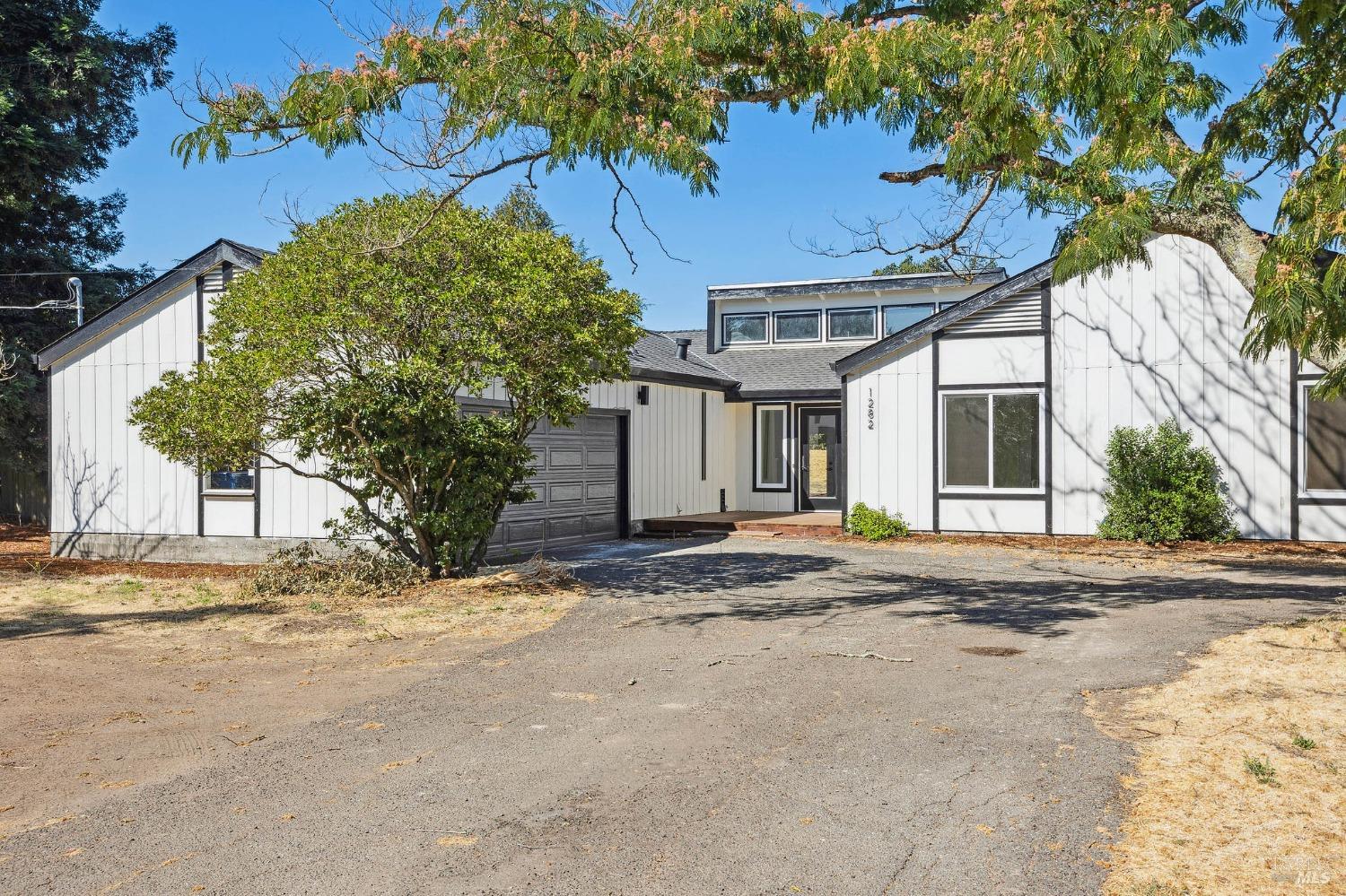 1282 Fowler Creek Road Sonoma, CA 95476 - Photo 2 of 86 a view of a house with a tree in front