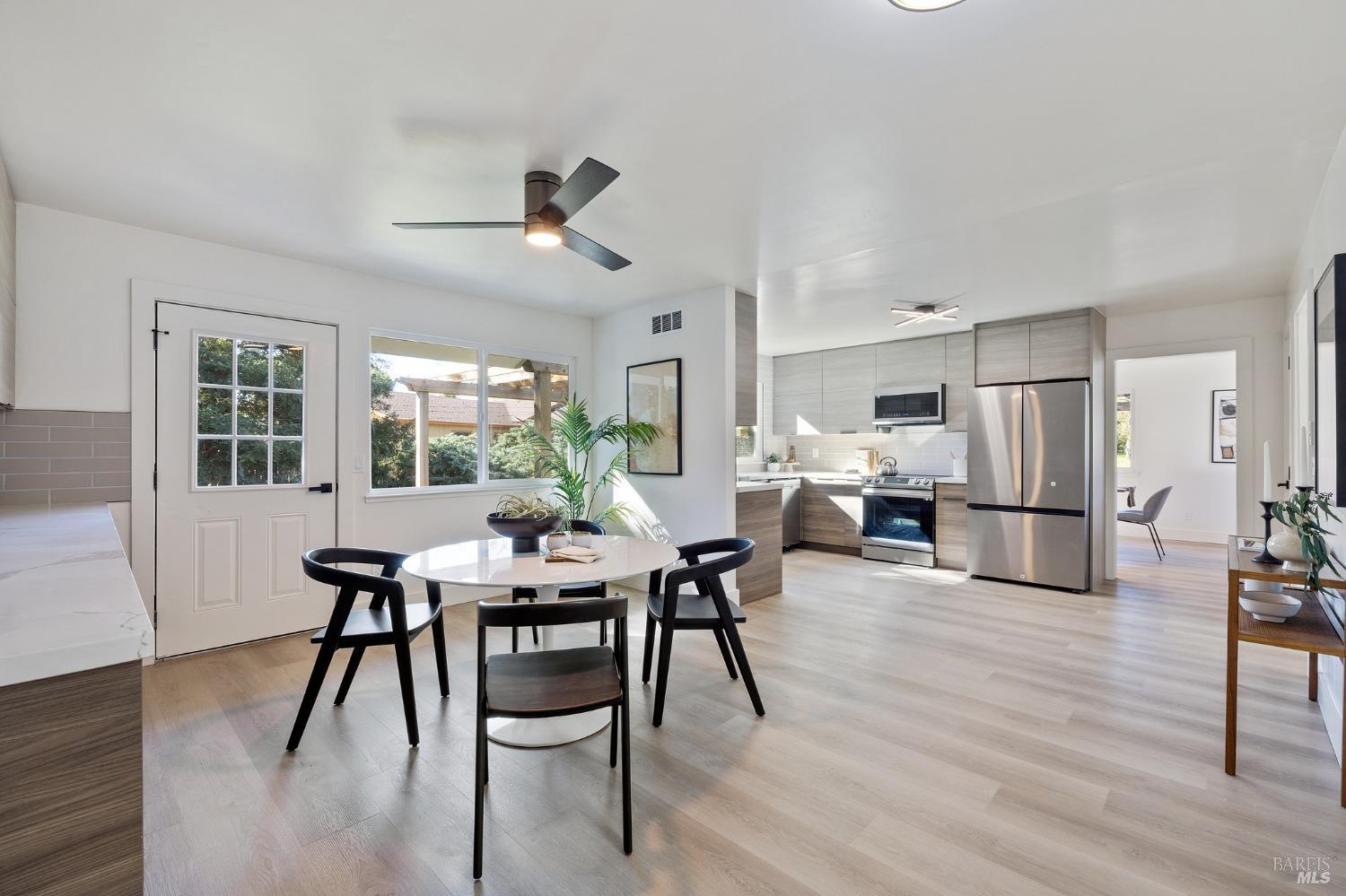 1282 Fowler Creek Road Sonoma, CA 95476 - Photo 22 of 86 a view of a dining room with furniture and wooden floor