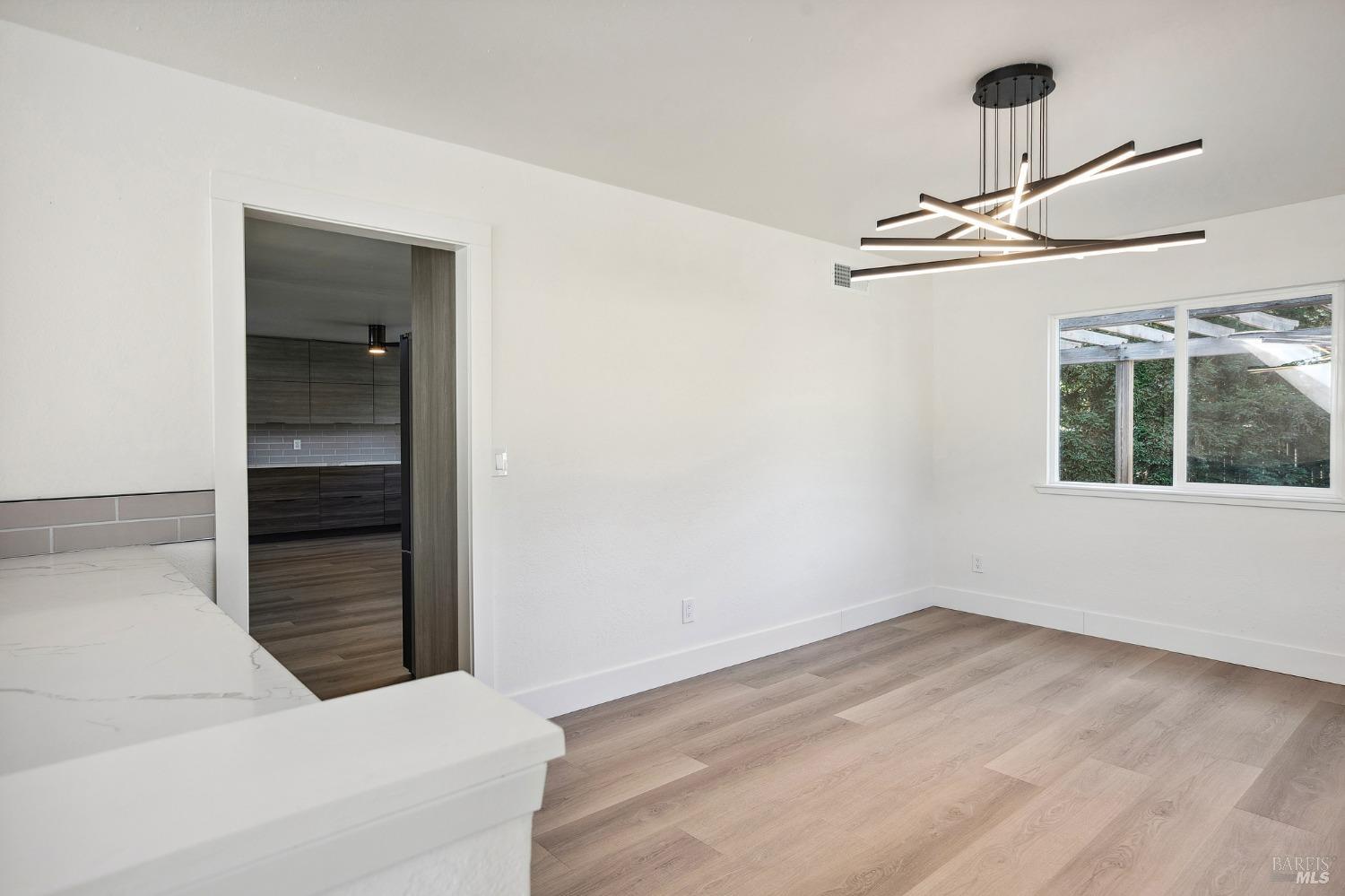 1282 Fowler Creek Road Sonoma, CA 95476 - Photo 28 of 86 a view of a room with wooden floor cabinet and a window