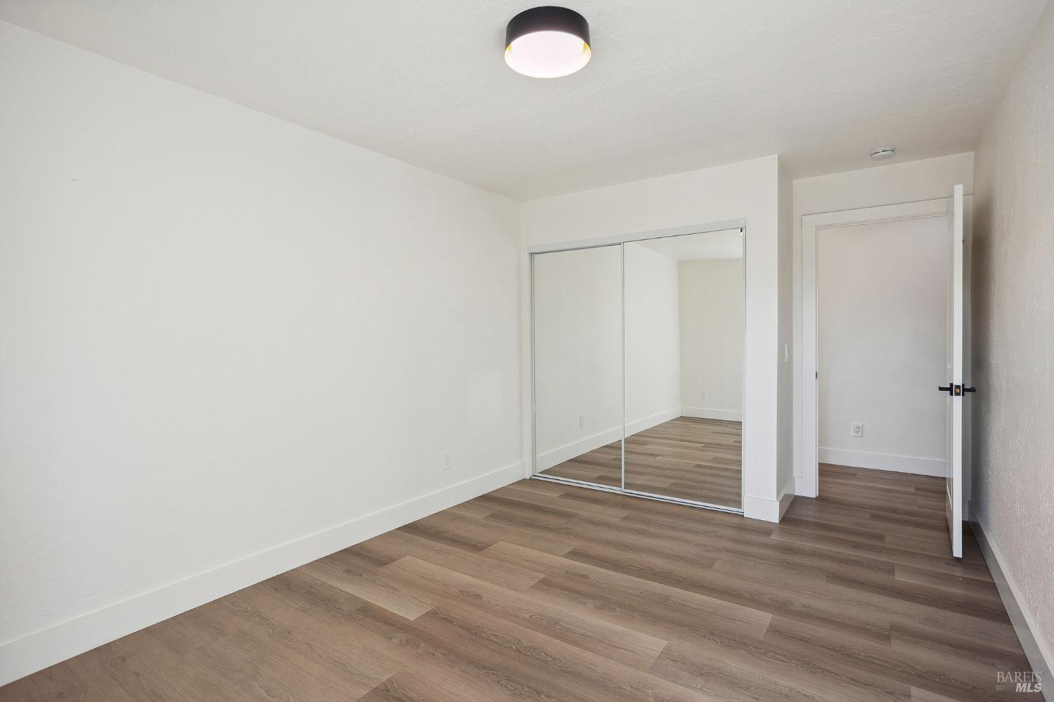 1282 Fowler Creek Road Sonoma, CA 95476 - Photo 42 of 86 a view of empty room with wooden floor