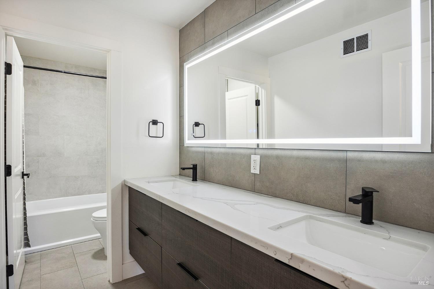 1282 Fowler Creek Road Sonoma, CA 95476 - Photo 49 of 86 a bathroom with a sink and a mirror