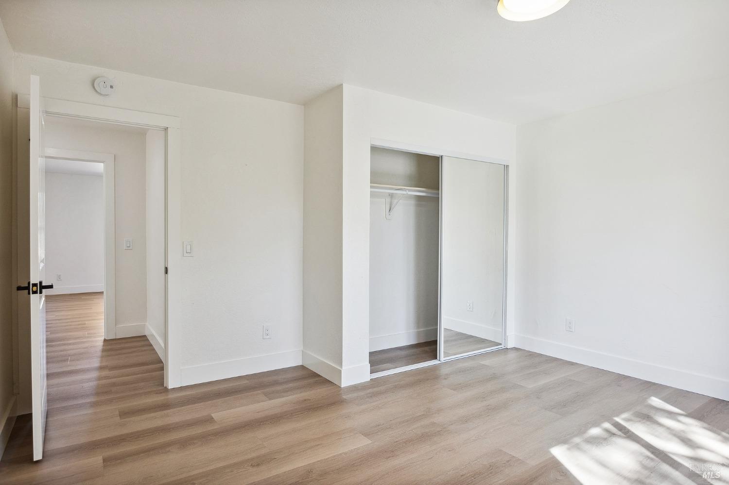 1282 Fowler Creek Road Sonoma, CA 95476 - Photo 54 of 86 a view of an empty room with wooden floor