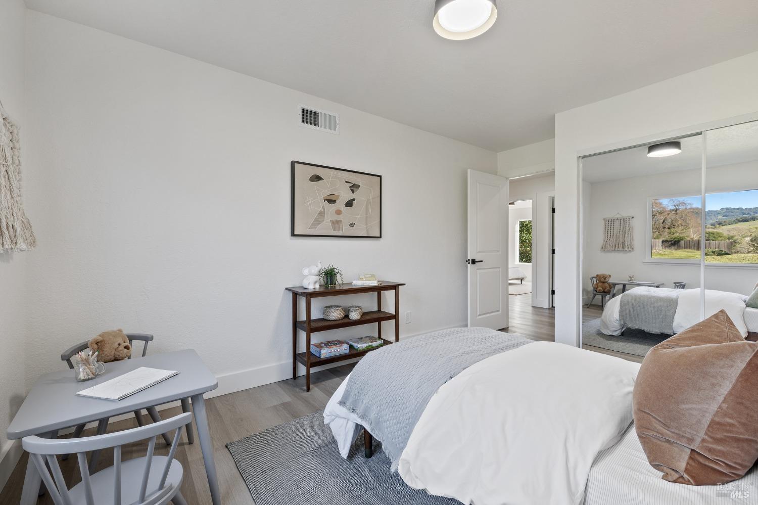 1282 Fowler Creek Road Sonoma, CA 95476 - Photo 55 of 86 a bedroom with a bed and furniture