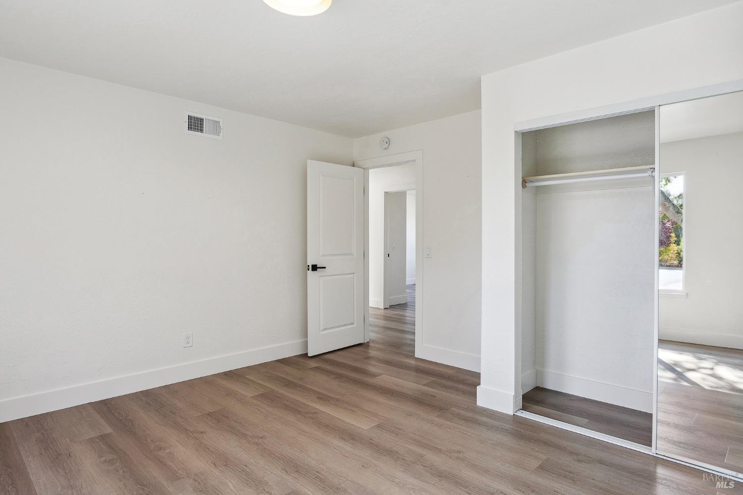 1282 Fowler Creek Road Sonoma, CA 95476 - Photo 56 of 86 an empty room with wooden floor & windows