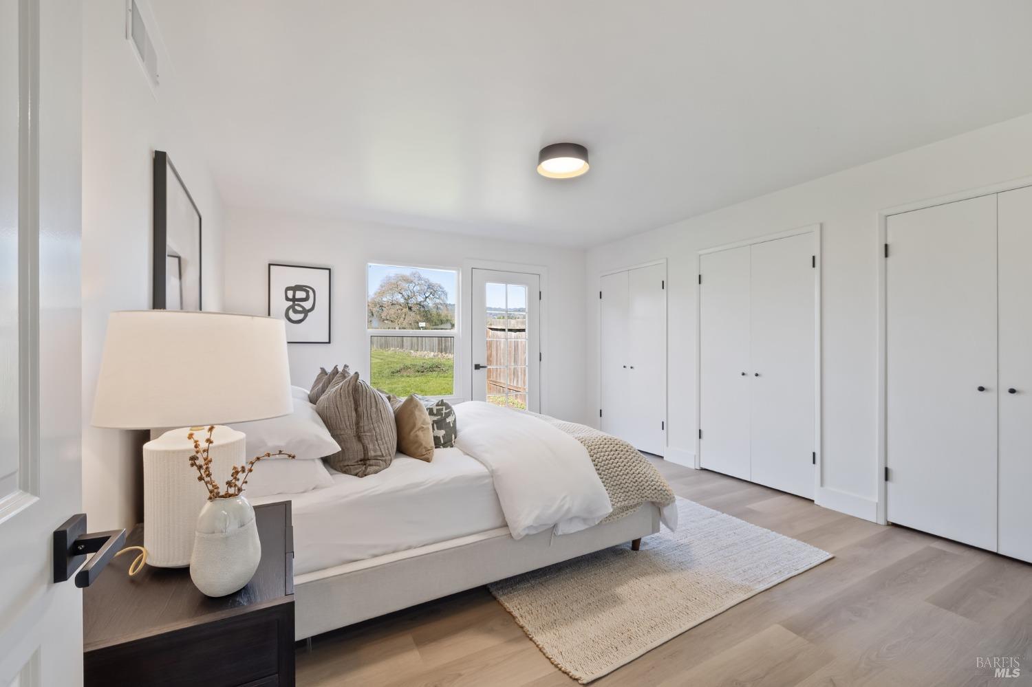 1282 Fowler Creek Road Sonoma, CA 95476 - Photo 57 of 86 a bedroom with a bed and painting on the wall