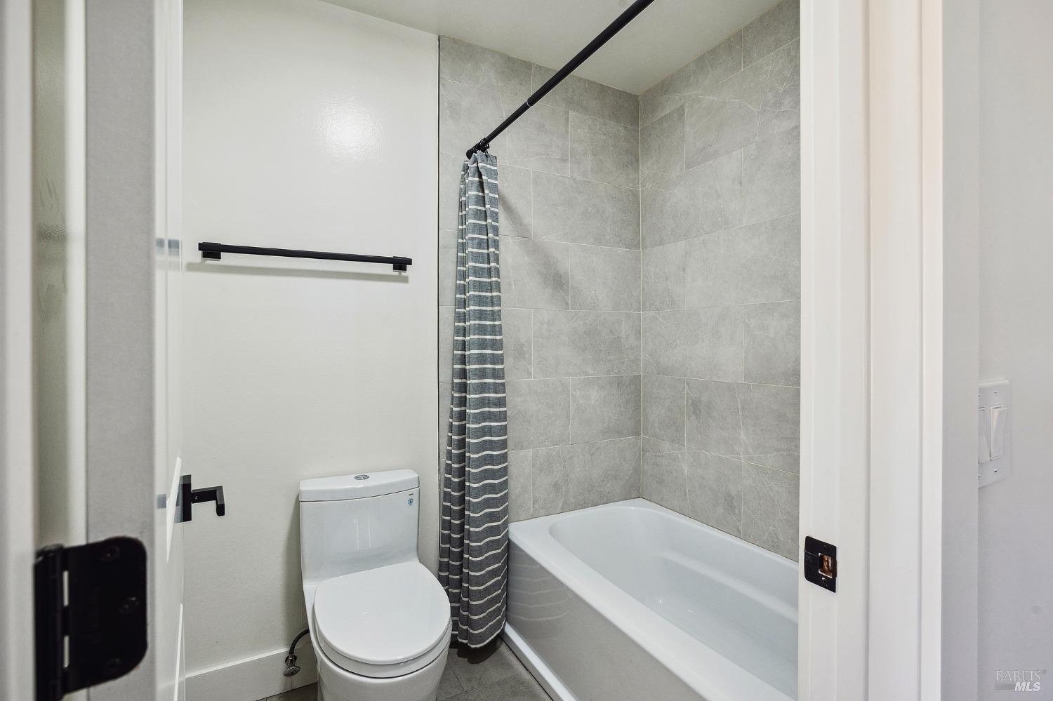 1282 Fowler Creek Road Sonoma, CA 95476 - Photo 59 of 86 a white toilet sitting next to a bathroom sink