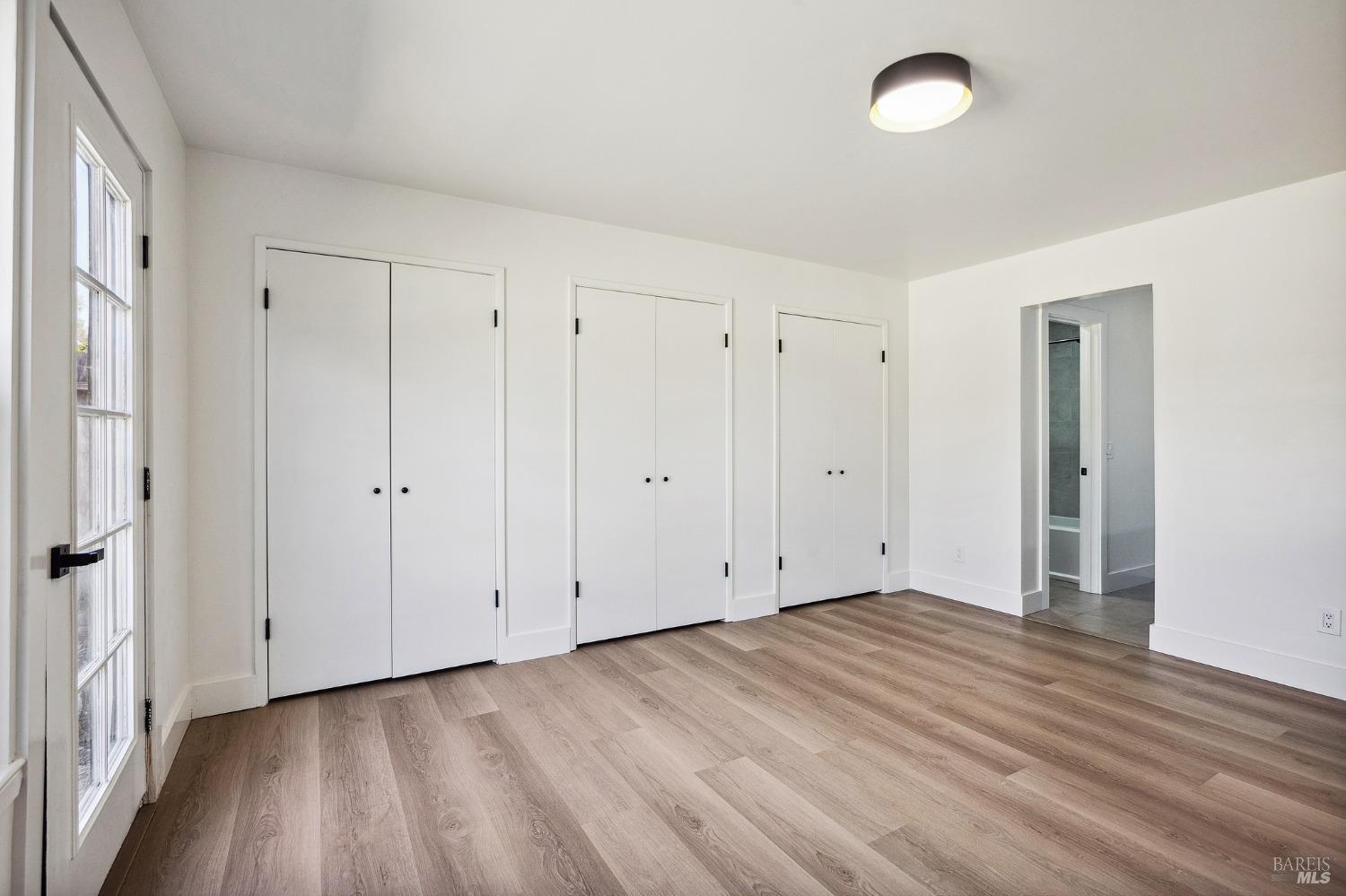 1282 Fowler Creek Road Sonoma, CA 95476 - Photo 60 of 86 a view of an empty room with wooden floor