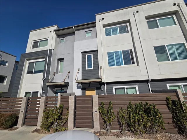 a front view of a building with many windows