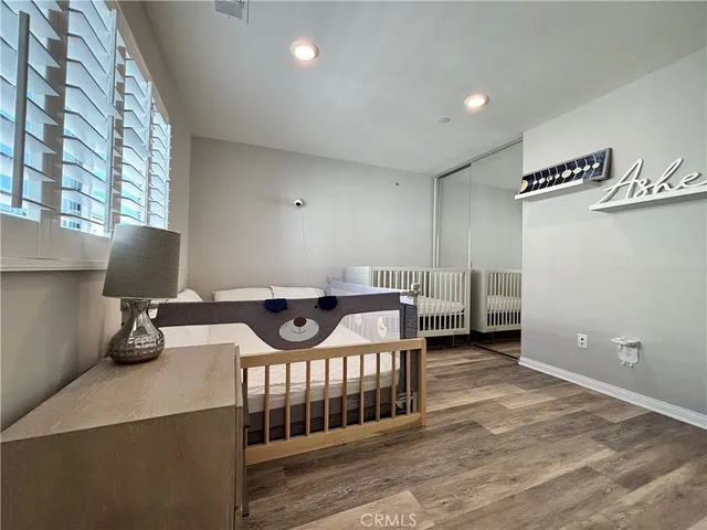 a view of a room with furniture and a chandelier