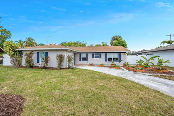 front view of a house with a yard