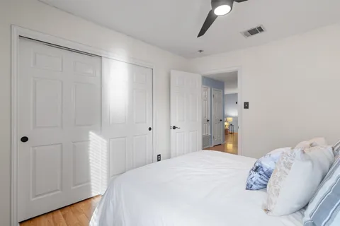 a bedroom with a bed and a shower