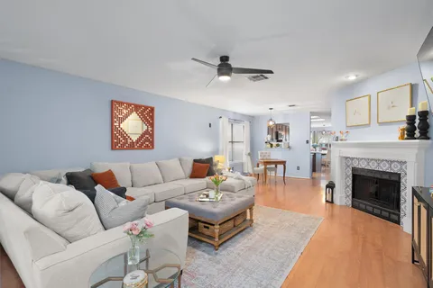 a living room with furniture and a fireplace