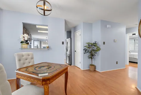 a view of a livingroom with furniture and mirror