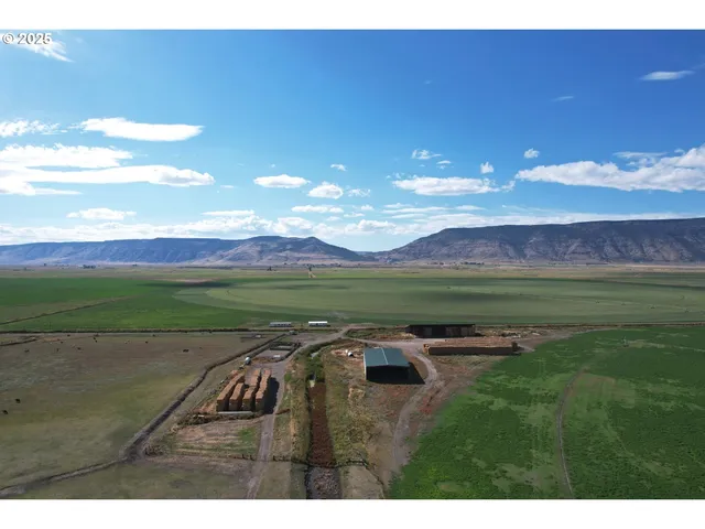 a view of a golf course with an ocean