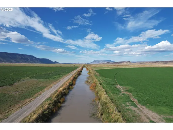a view of a lake with a big yard