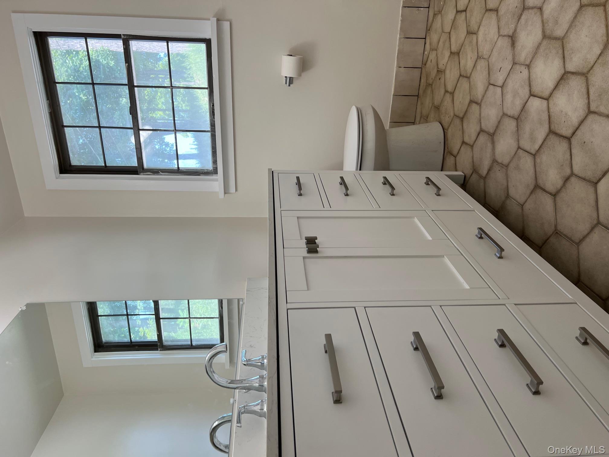121 East Hook Cross Road Hopewell Junction, NY 12533 - Photo 8 of 16 a bathroom with a toilet sink and window