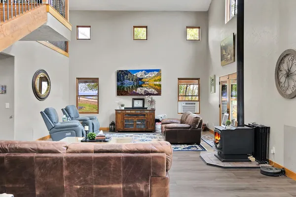 a living room with furniture a couch and a flat screen tv