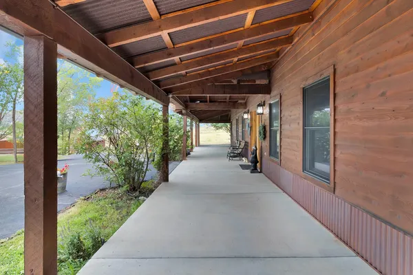 a view of hallway with balcony and outer view