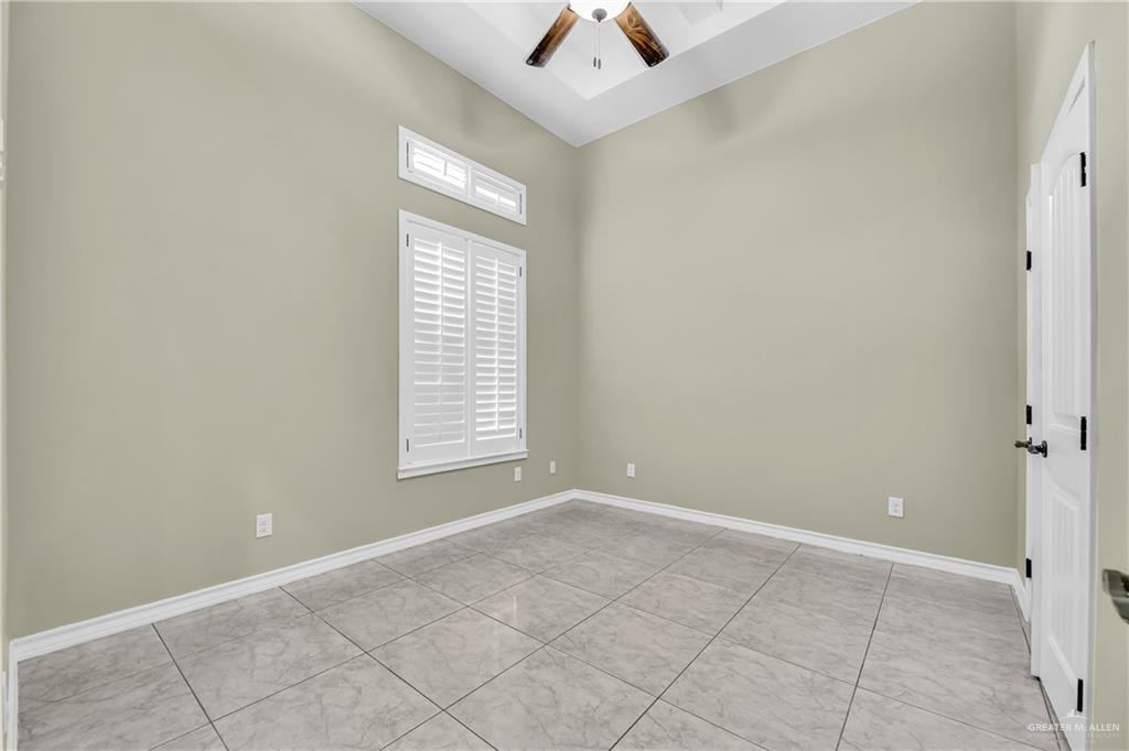 1106 Rio Blanco Street San Juan, TX 78589 - Photo 12 of 21 an empty room with a window and a chandelier fan