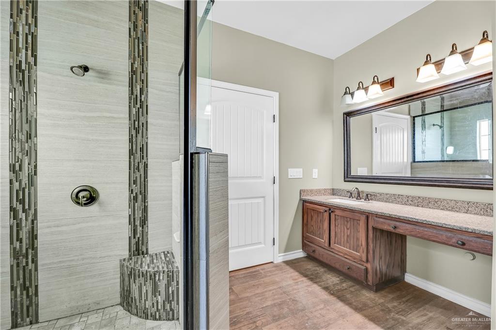 1106 Rio Blanco Street San Juan, TX 78589 - Photo 15 of 21 a bathroom with a granite countertop sink and a mirror