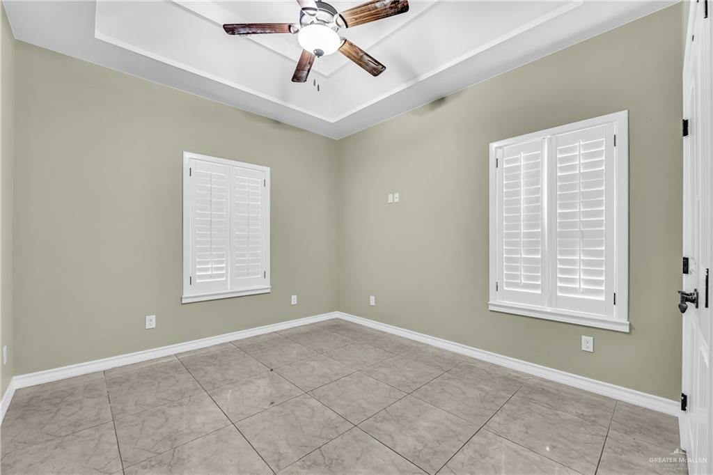 1106 Rio Blanco Street San Juan, TX 78589 - Photo 16 of 21 an empty room with windows and fan
