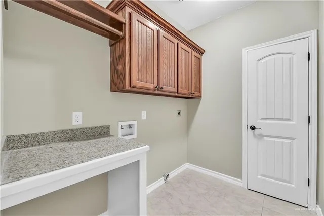 a hallway with granite countertop cabinets