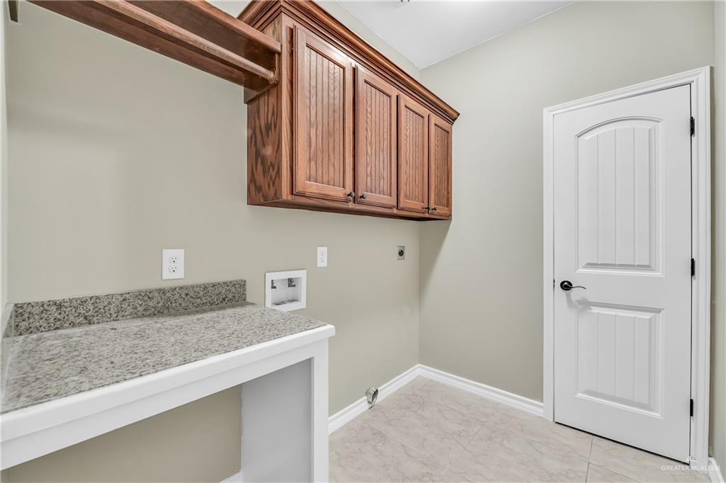 1106 Rio Blanco Street San Juan, TX 78589 - Photo 10 of 21 a hallway with granite countertop cabinets