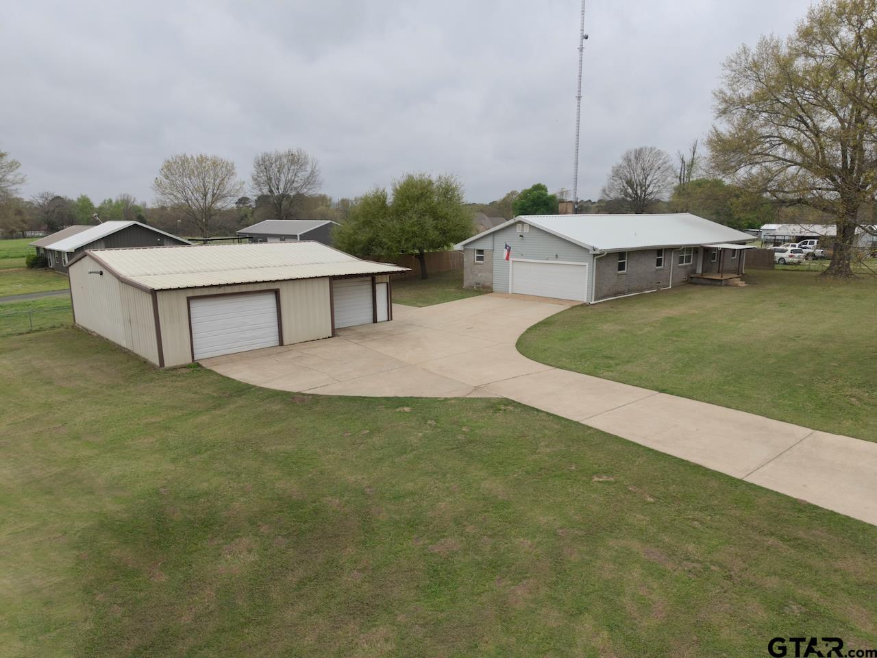 667 Allen Road Longview, TX 75605 - Photo 37 of 48 a view of a house with a yard and a sitting area