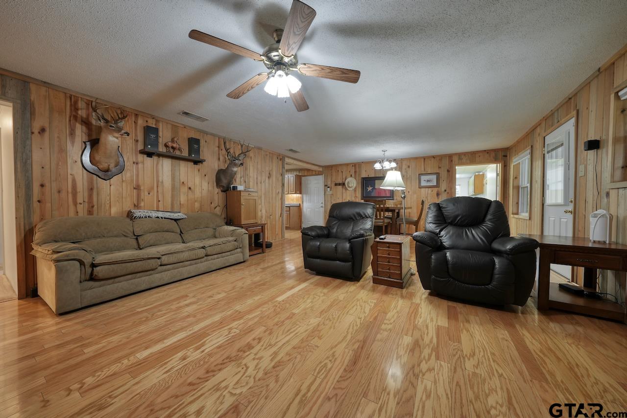 667 Allen Road Longview, TX 75605 - Photo 7 of 48 a living room with furniture and wooden floor