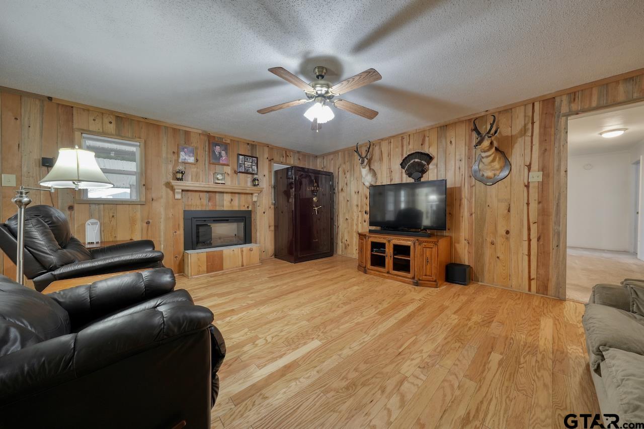 667 Allen Road Longview, TX 75605 - Photo 9 of 48 a living room with furniture and a flat screen tv