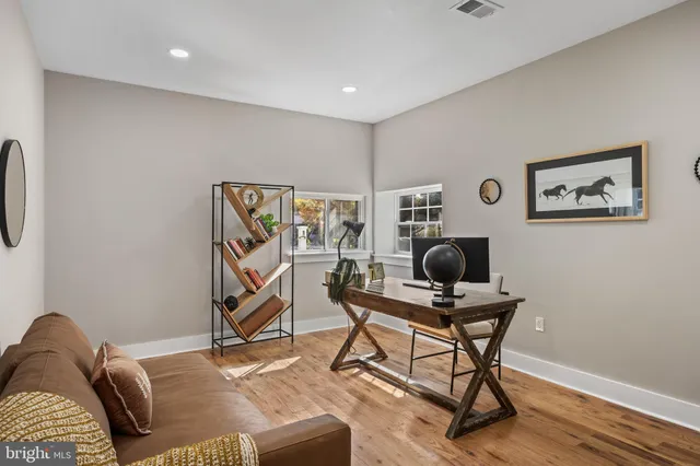 a work room with furniture and wooden floor