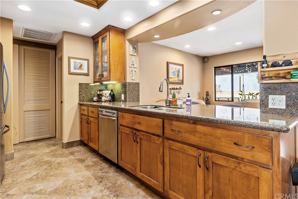 60467 Natoma Trail Joshua Tree, CA 92252 - Photo 12 of 63 a bathroom with a granite countertop sink and a large mirror