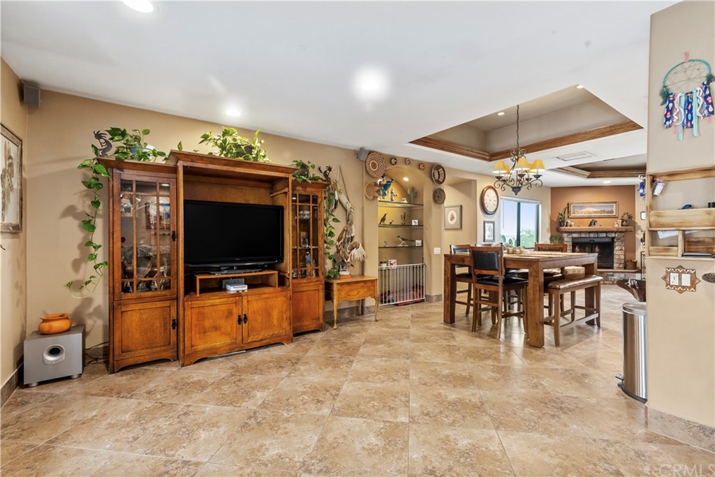 60467 Natoma Trail Joshua Tree, CA 92252 - Photo 16 of 63 a view of a livingroom with furniture and a flat screen tv