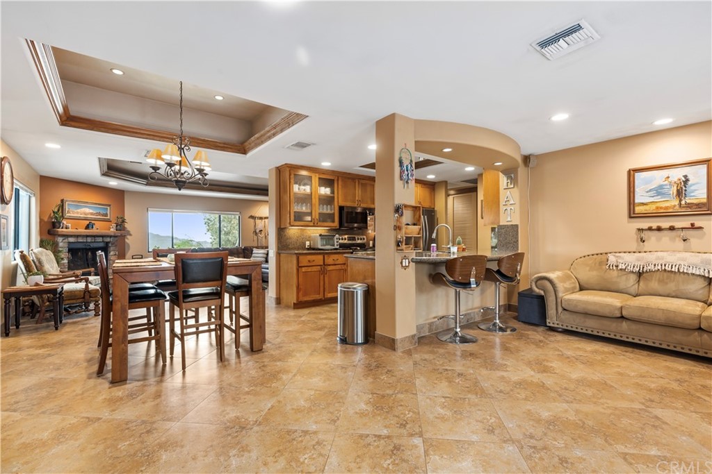 60467 Natoma Trail Joshua Tree, CA 92252 - Photo 17 of 63 a living room with lots of furniture and kitchen view