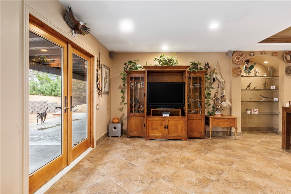 60467 Natoma Trail Joshua Tree, CA 92252 - Photo 18 of 63 a living room with furniture and a flat screen tv