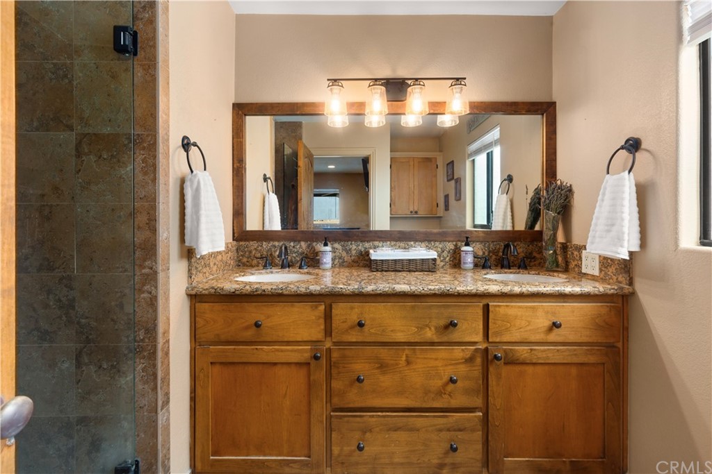60467 Natoma Trail Joshua Tree, CA 92252 - Photo 24 of 63 a bathroom with a sink and a mirror