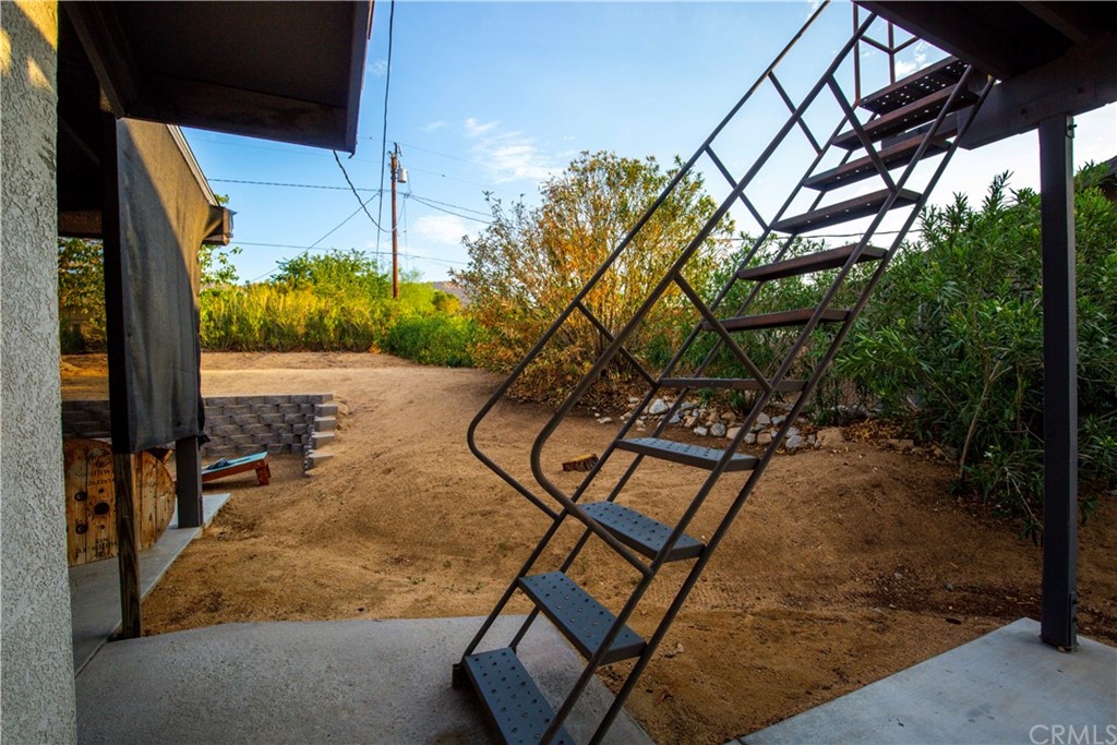 60467 Natoma Trail Joshua Tree, CA 92252 - Photo 59 of 63 a view of a swimming pool with a patio