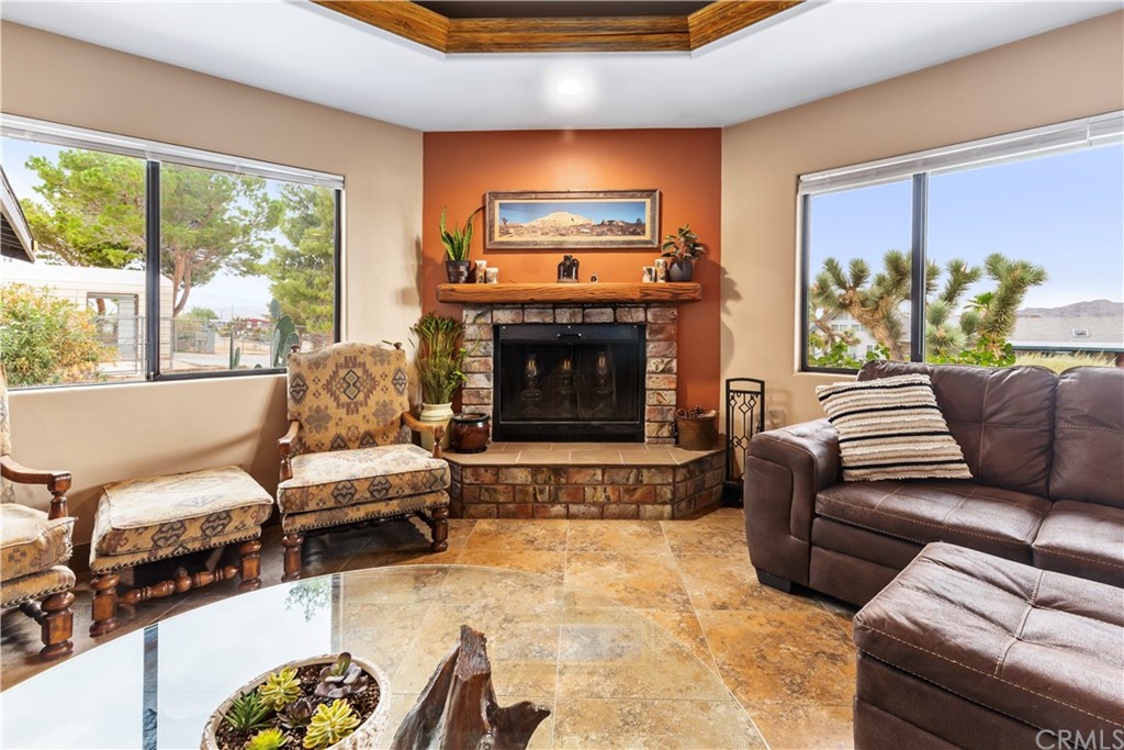 60467 Natoma Trail Joshua Tree, CA 92252 - Photo 7 of 63 a living room with furniture and a fireplace