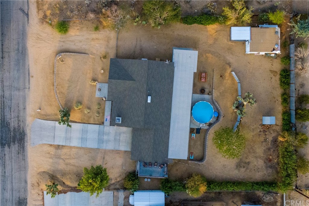 60467 Natoma Trail Joshua Tree, CA 92252 - Photo 63 of 63 an aerial view of a house with a yard and a fountain