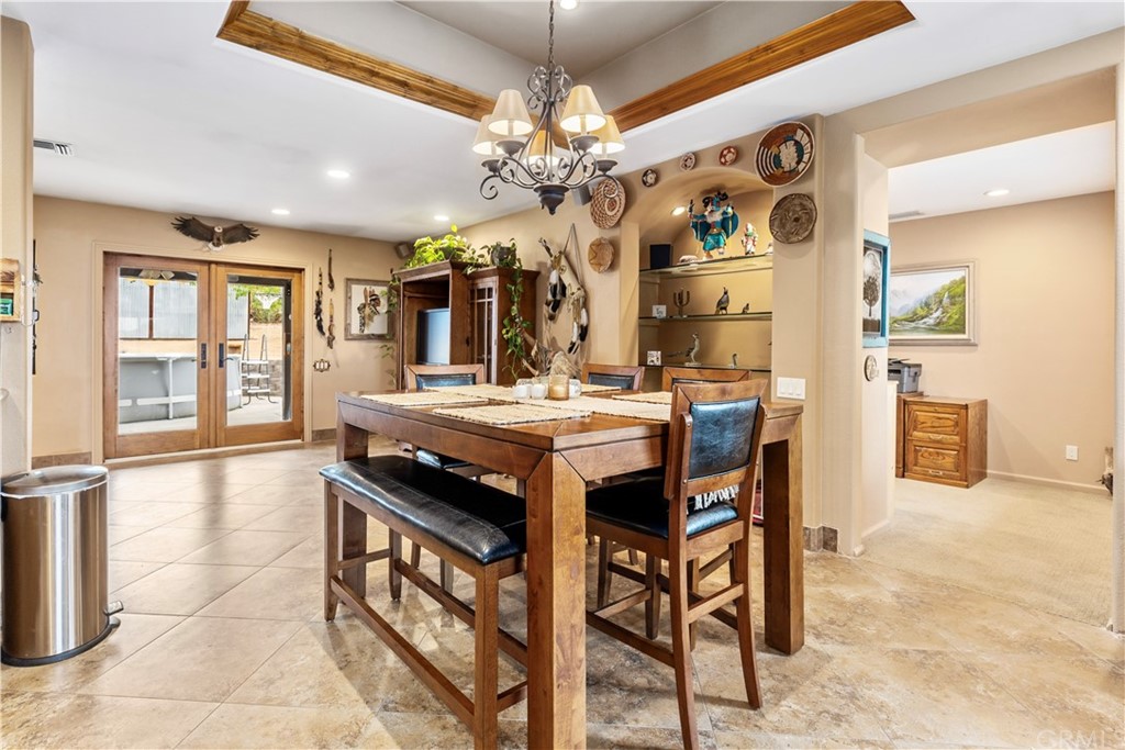 60467 Natoma Trail Joshua Tree, CA 92252 - Photo 9 of 63 a dining room filled chandelier and wooden floor